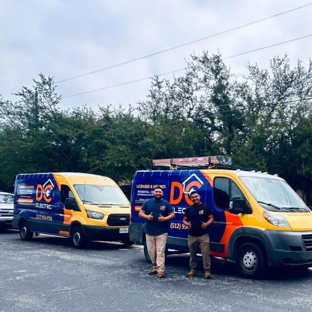 Trucks lined up for an early start — licensed residential electrician in Austin TX (DC Electric)