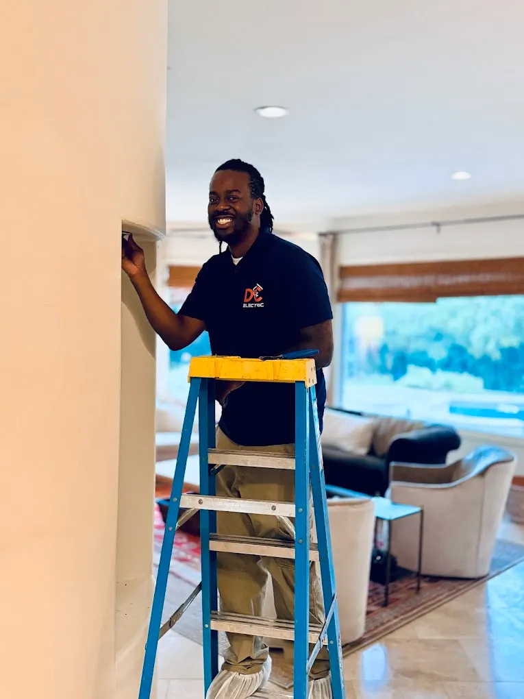 Lovell replacing a light fixture