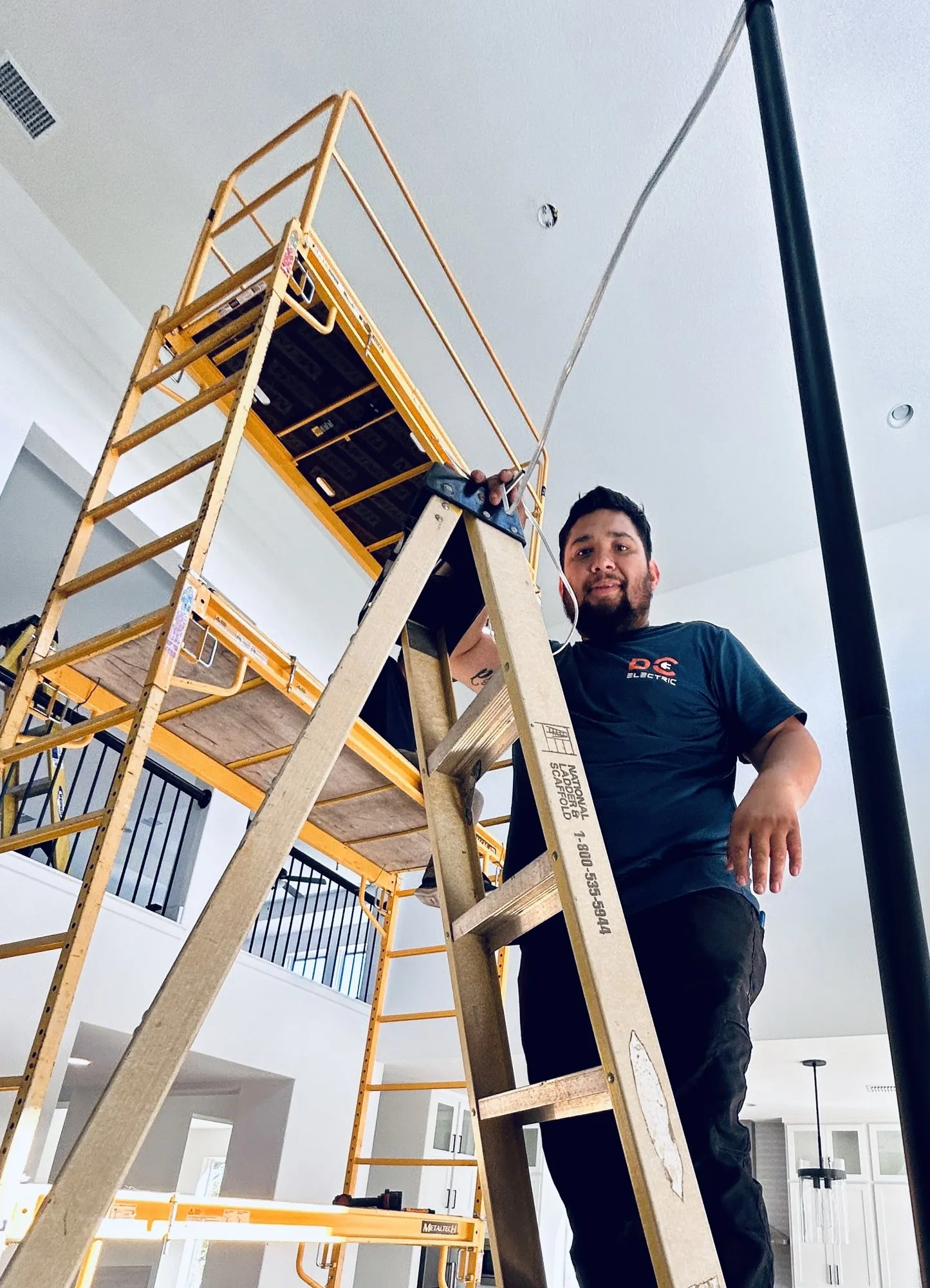 A massive chandelier handled with care — licensed residential electrician in Austin TX (DC Electric)