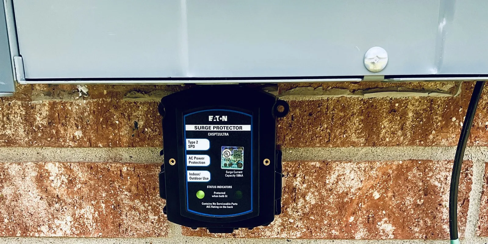 An Eaton whole-house surge protector installed at the main panel of an Austin home.