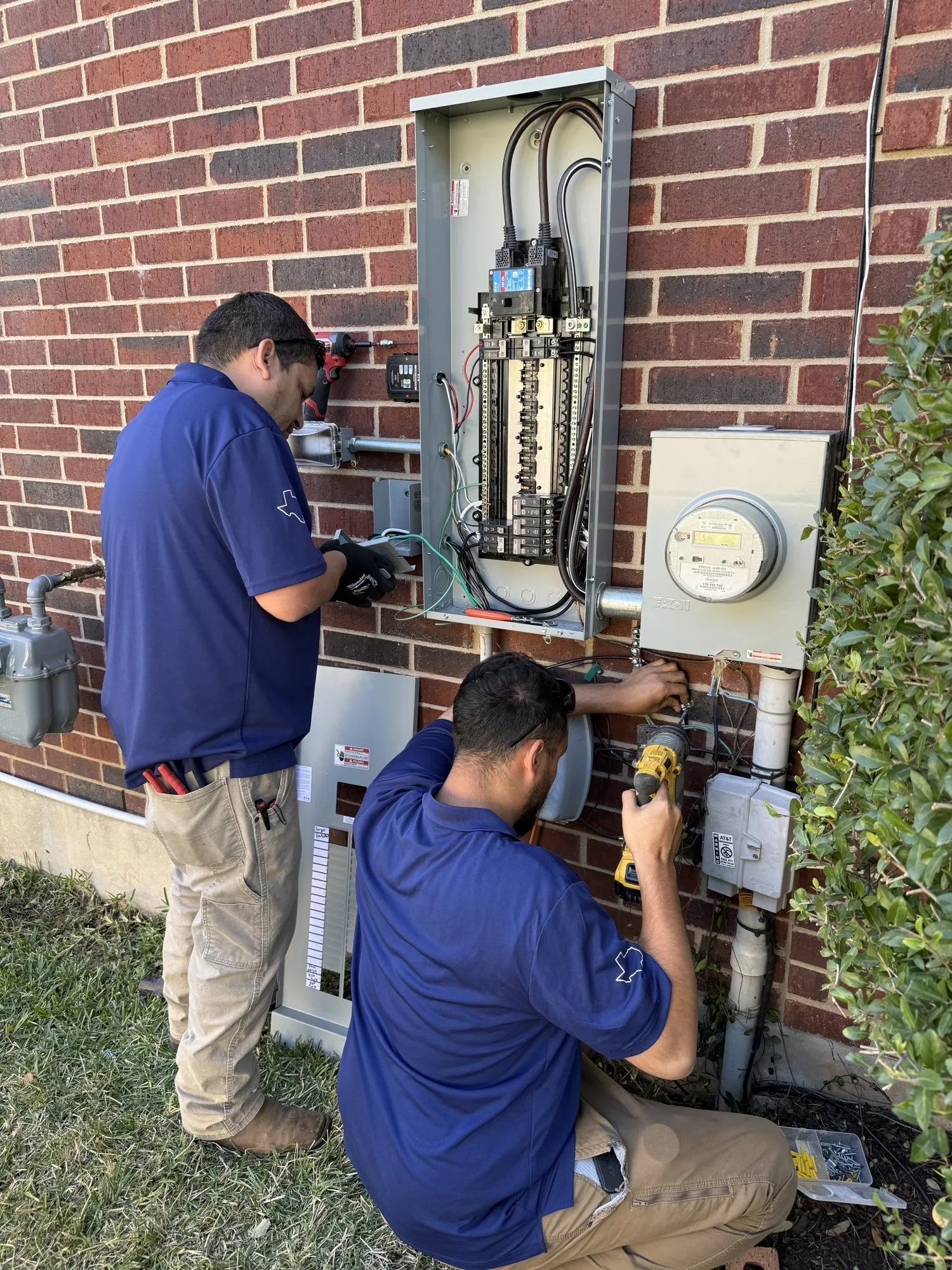 The team wrapping up the details — licensed residential electrician in Austin TX (DC Electric)