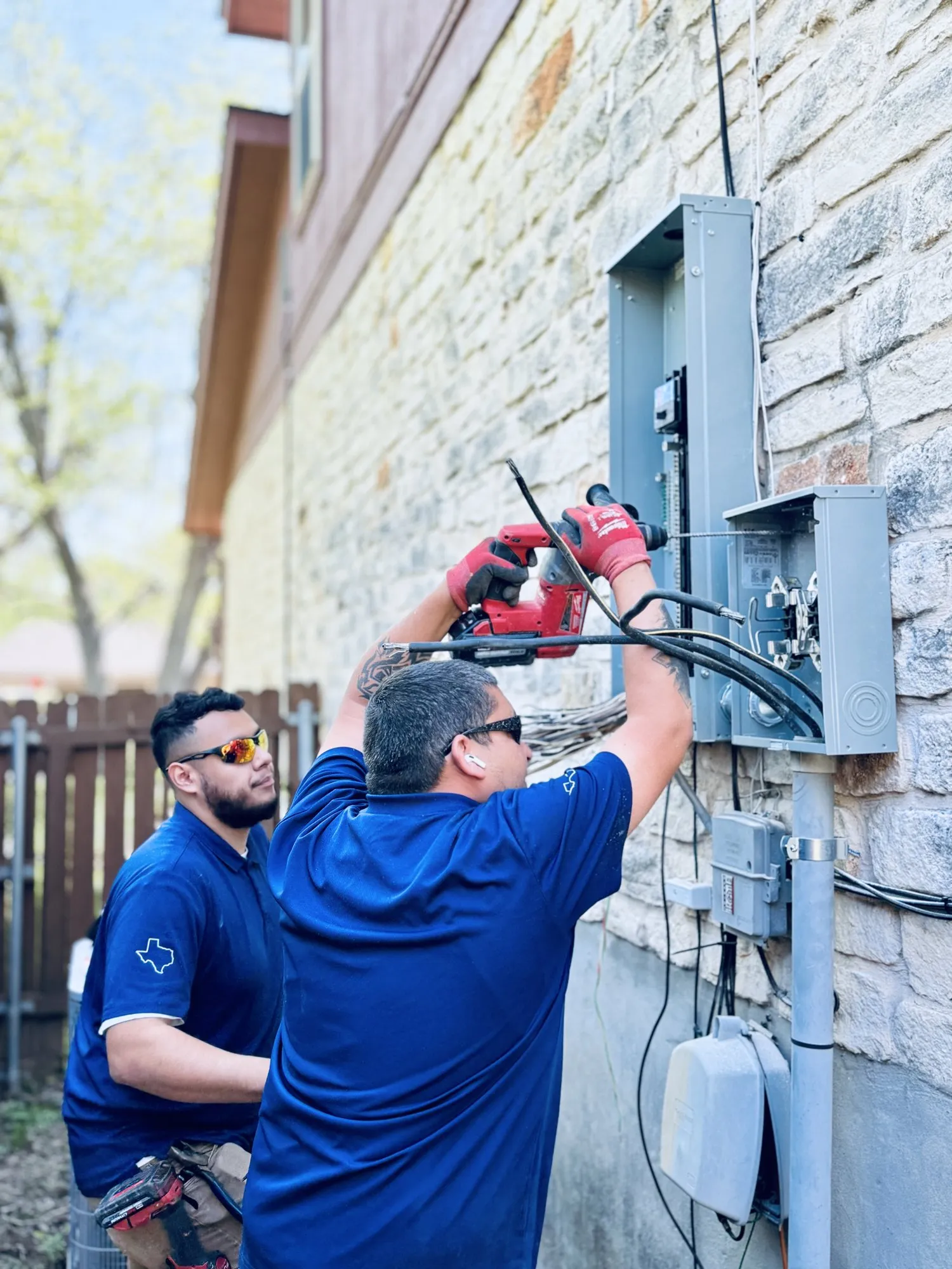 Teamwork getting it done — licensed residential electrician in Austin TX (DC Electric)