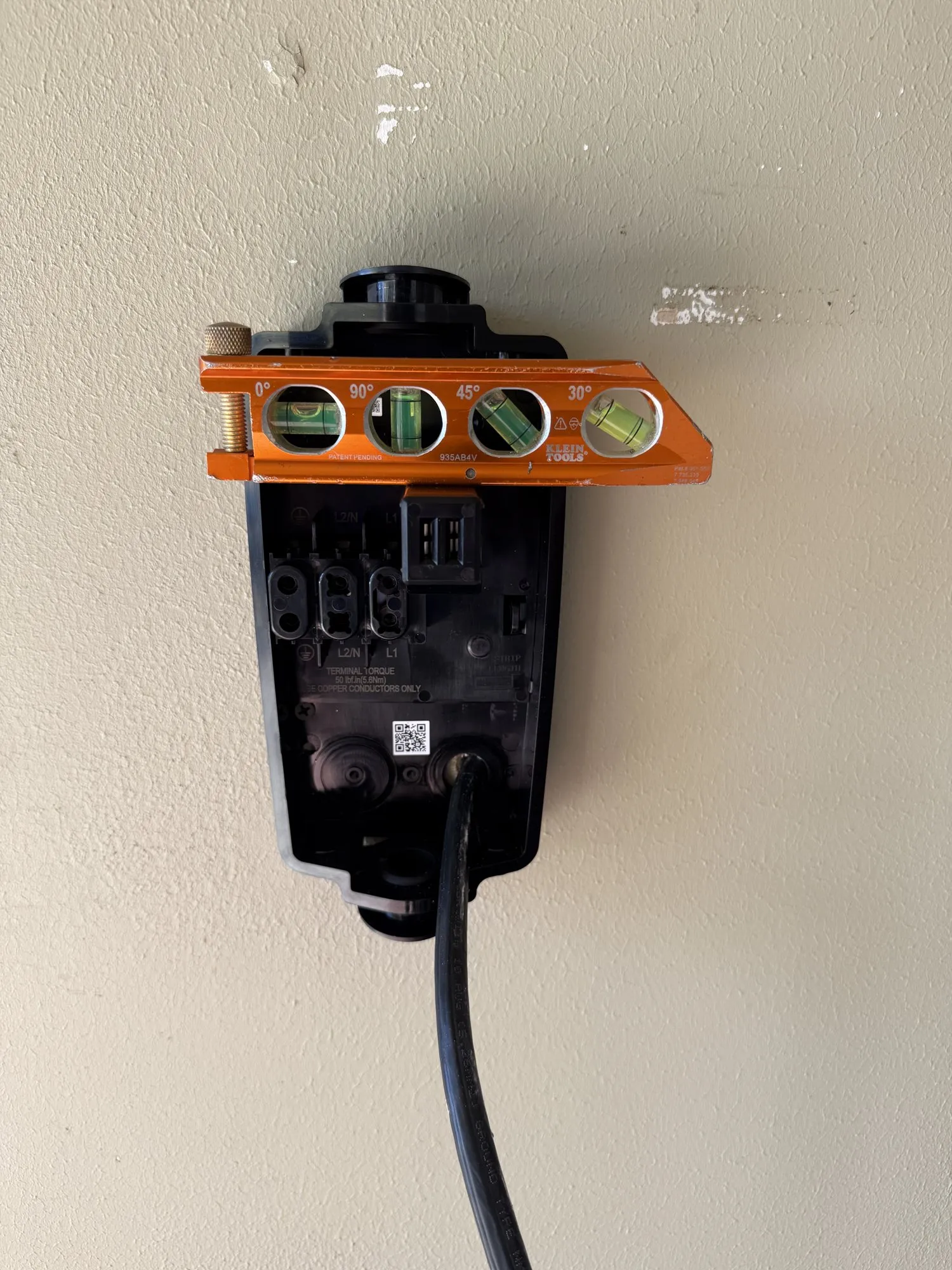 Tesla Wall Connector installed by DC Electric in an Austin garage with permit and load calculation.