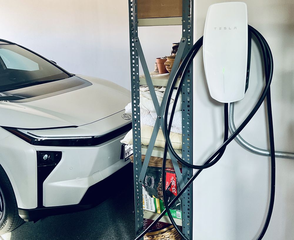 Universal connector installed in an Austin garage charging a Toyota EV — one charger, any EV