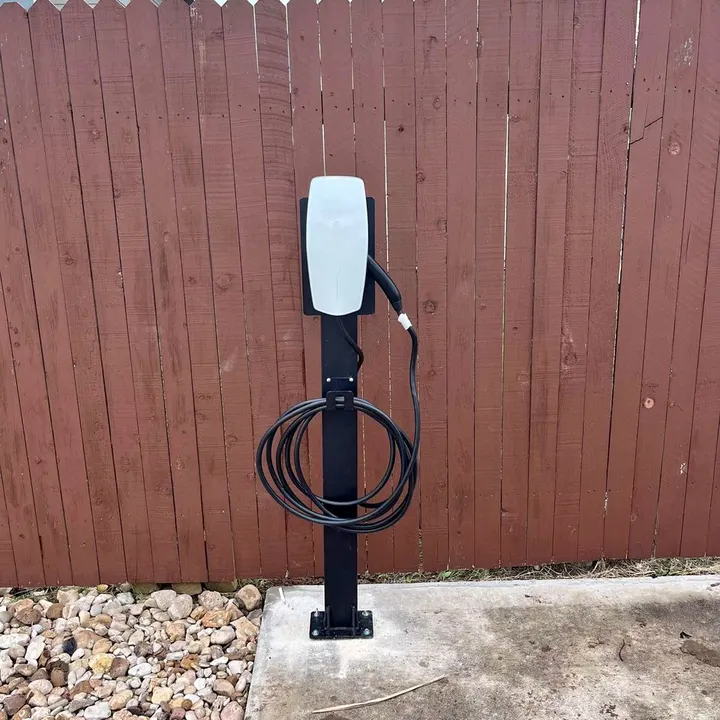 Custom pedestal-mounted Tesla Wall Connector EV charger installed by DC Electric