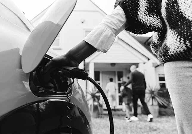 Electric vehicle charging in Austin home by DC Electric, offering expert EV charger installations in Travis County, TX, and surrounding areas